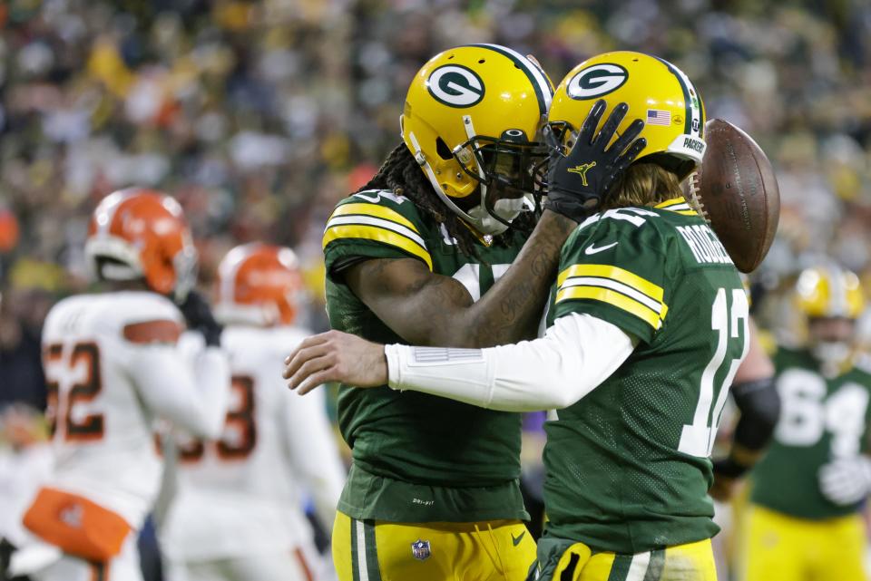 Green Bay Packers' Davante Adams celebrates his touchdown reception with Aaron Rodgers during the first half of an NFL football game against the Cleveland Browns Saturday, Dec. 25, 2021, in Green Bay, Wis. (AP Photo/Matt Ludtke)