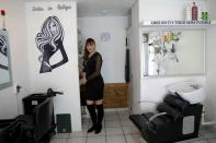 Alma Delia Diaz, 45, poses for a photo inside her Beauty salon in Ecatepec, State of Mexico,