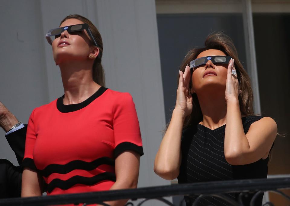 <p>To watch the solar eclipse on the White House balcony, Melania paired a slim-fitting black dress with a pair of protective eye glasses.</p>