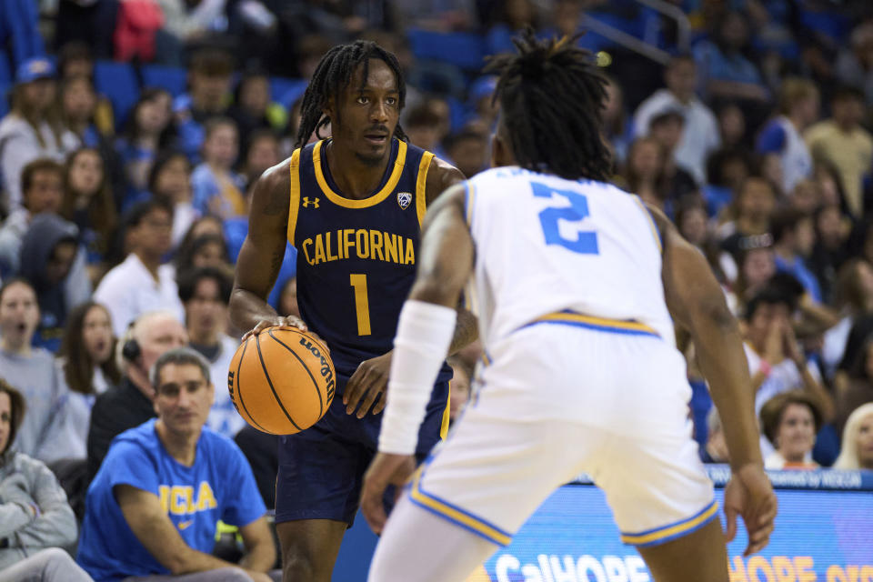 California guard Joel Brown (1) is defended by UCLA guard Dylan Andrews (2) during the first half of an NCAA college basketball game Saturday, Feb. 18, 2023, in Los Angeles. (AP Photo/Allison Dinner)