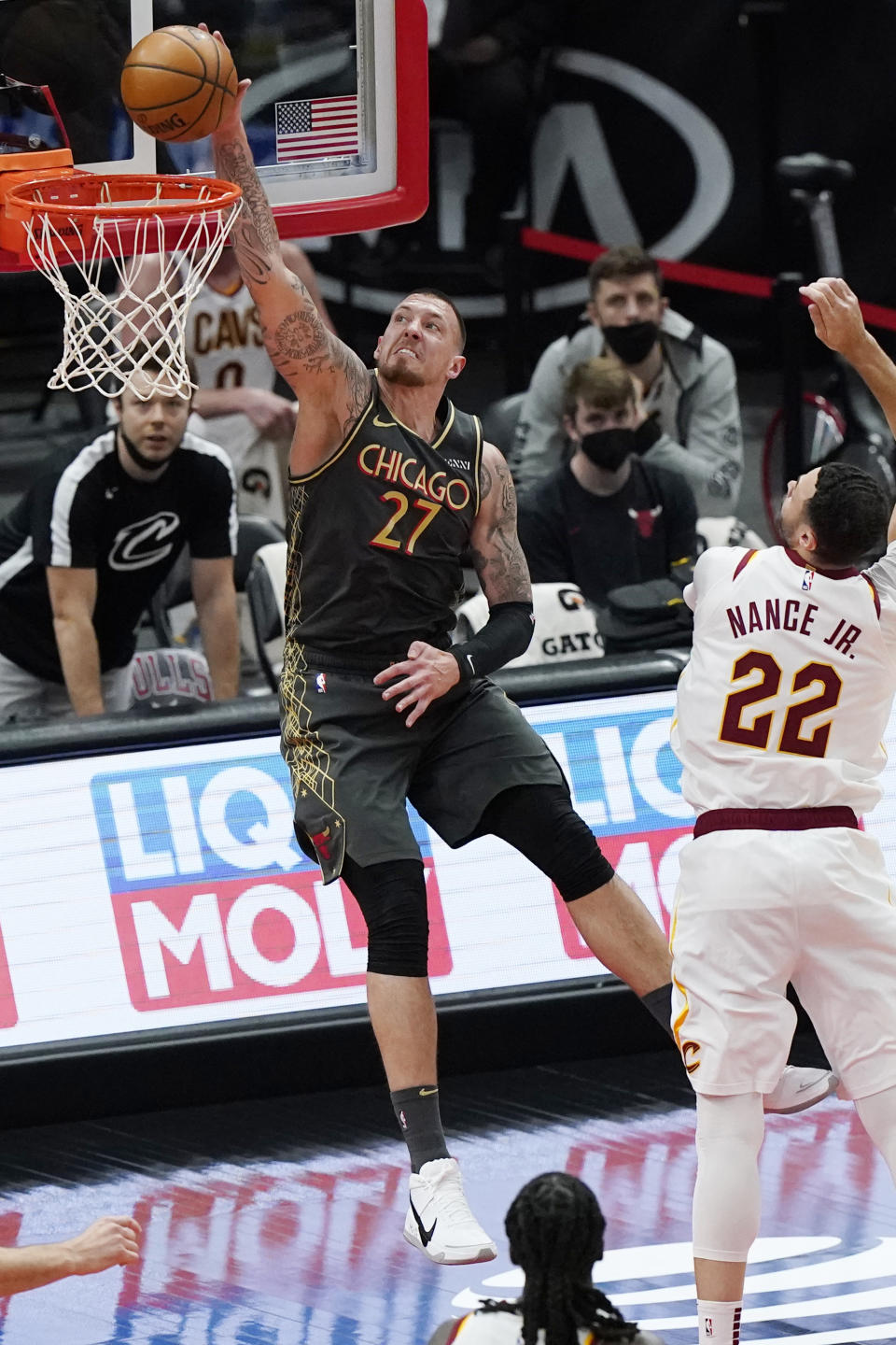 Chicago Bulls center Daniel Theis dunks against Cleveland Cavaliers forward Larry Nance Jr. during the second half of an NBA basketball game in Chicago, Saturday, April 17, 2021. (AP Photo/Nam Y. Huh)