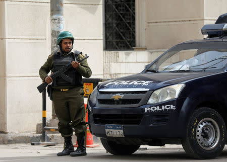 An armed policeman secures the Coptic church that was bombed on Sunday in Tanta, Egypt April 10, 2017. REUTERS/Mohamed Abd El Ghany