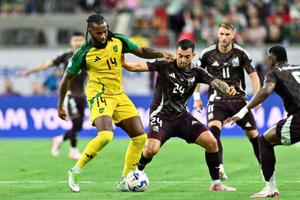 Jun 22, 2024; Houston, TX, USA; Jamaica midfielder Kasey Palmer (14) controls the ball as Mexico midfielder Luis Chavez (24) defends during the first half at NRG Stadium. Mandatory Credit: Maria Lysaker-USA TODAY Sports