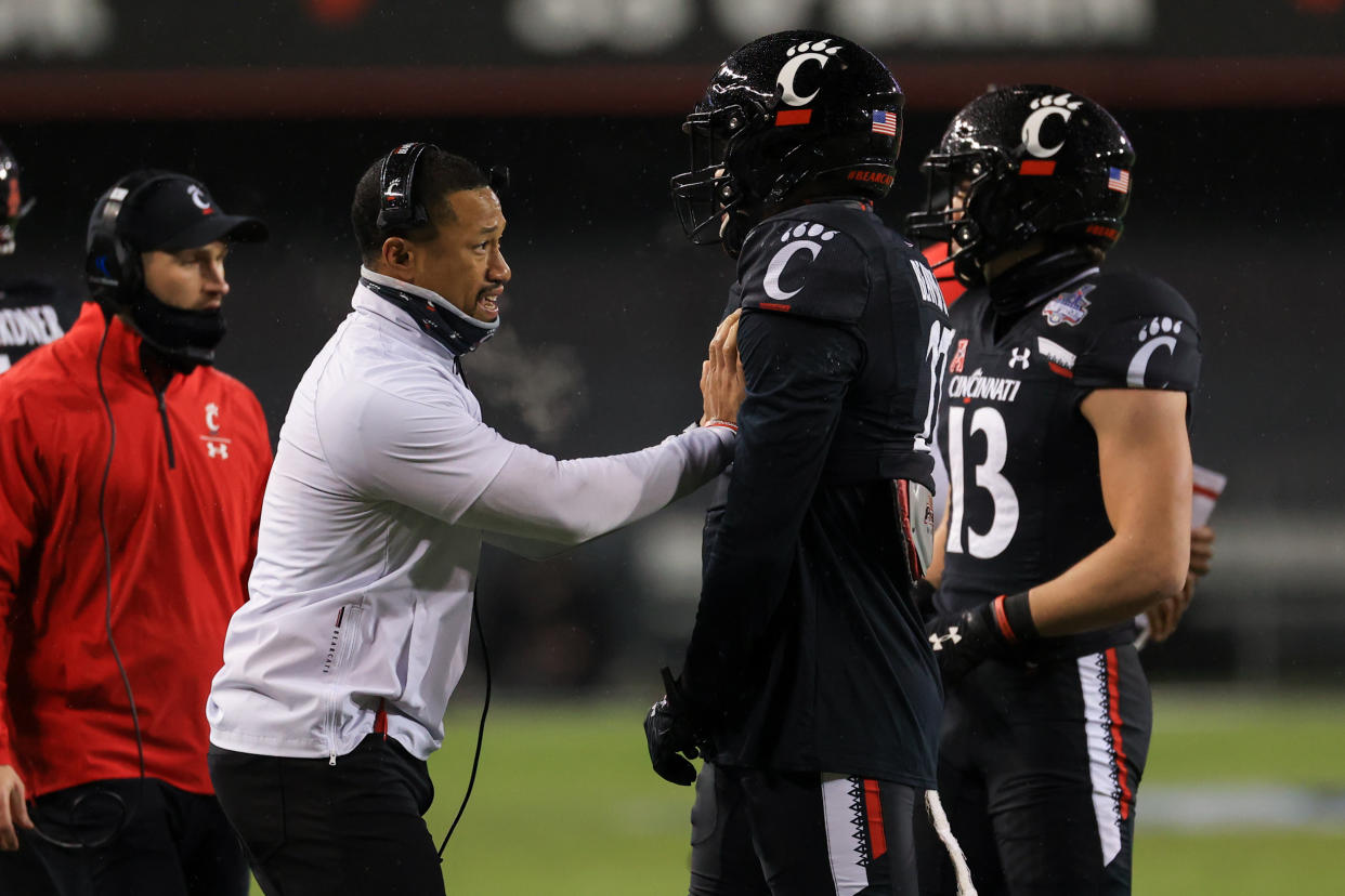 CINCINNATI, OH - DECEMBER 19: Cincinnati Bearcats defensive coordinator Marcus Freeman talks with a player  during the AAC Championship game against the Tulsa Golden Hurricane and the Cincinnati Bearcats on December 19, 2020, at Nippert Stadium in Cincinnati, OH. (Photo by Ian Johnson/Icon Sportswire via Getty Images)