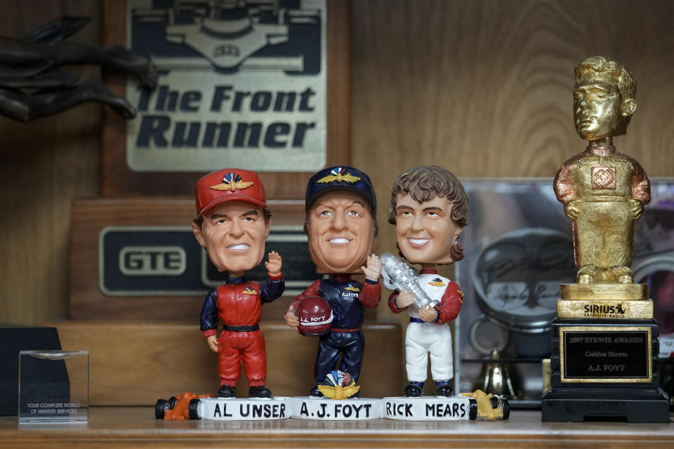 Bobblehead figures sit on a shelf in A.J. Foyt's office, Wednesday, March 29, 2023, in Waller, Texas. (AP Photo/Godofredo A. Vásquez)
