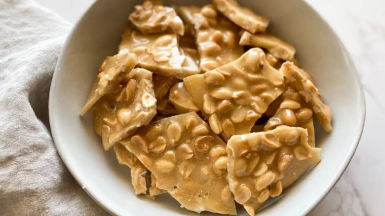 Homemade Peanut Brittle in bowl