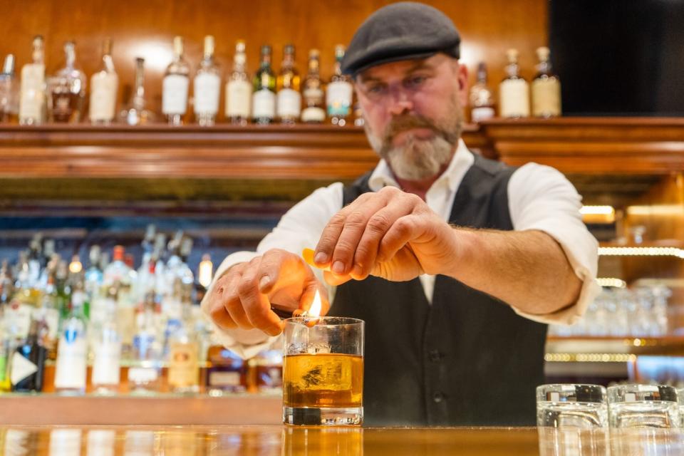 Bartender makes a cocktail along the Tupelo Cocktail Trail