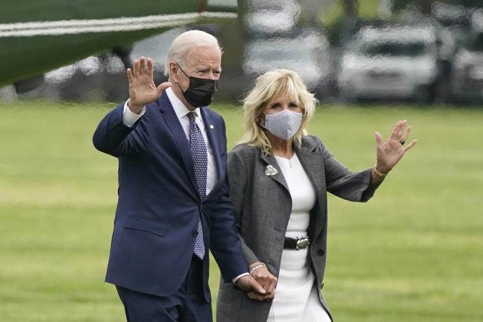 President Joe Biden and first lady Jill Biden wave after stepping off Marine One on the Ellipse near the White House, Monday, May 3, 2021, in Washington. (AP Photo/Patrick Semansky)
