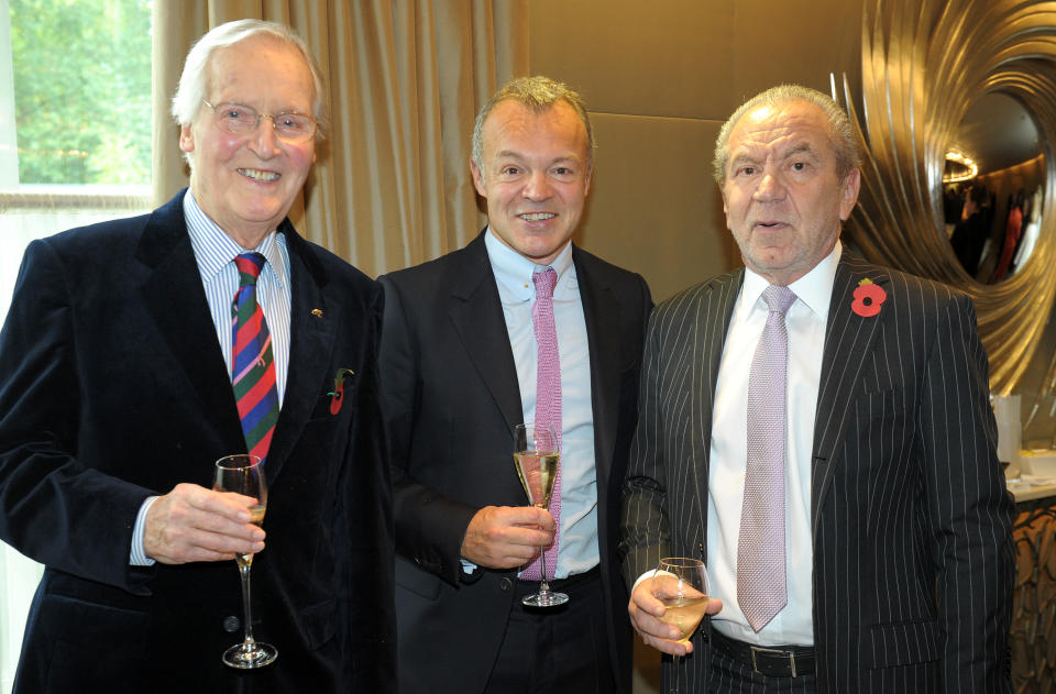 Guest of honour Graham Norton meets Nicholas Parsons (left) and Lord Alan Sugar as he attends a tribute lunch hosted by The Lady Taverners at the Dorchester Hotel, London.