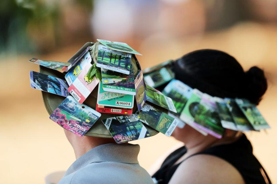 Masters patrons with badges on their hats