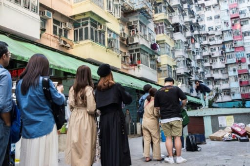 People line up to take a photo at a popular Instagram spot in Hong Kong