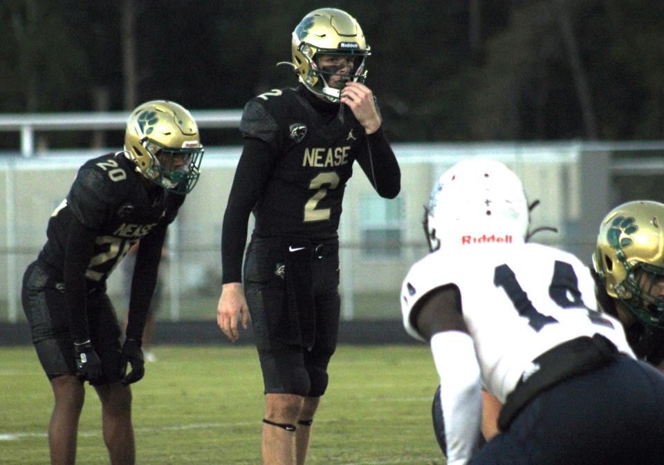 Nease quarterback Marcus Stokes (2) prepares to take the snap against Sandalwood during a high school football game on October 4, 2022. [Clayton Freeman/Florida Times-Union]