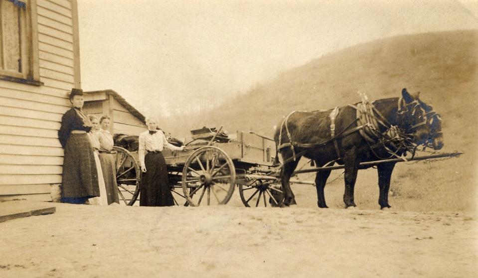 Frances Goodrich, one of the originators of the Southern Highland Craft Guild, preparing the wagon to take goods from Allanstand Cottage Industries to market.