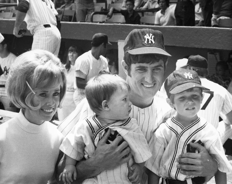 BRONX, NY - AUGUST 7:  Pitcher Fritz Peterson #19 of the New York Yankees with his wife and children, Marilyn, Eric, one, and Greg, four, during Family Day at Yankee Stadium on August 7, 1971 in the Bronx, New York.  (Photo by Louis Requena/MLB via Getty Images)