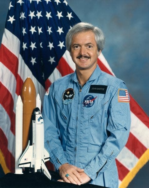 Astronaut JD Bartoe is pictured in his light blue flight suit during his days as a NASA astronaut. Bartoe flew on STS-51 F.
