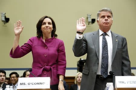 Former Internal Revenue Service (IRS) counsel Jennifer O'Connor (L), currently of the White House Counsel's Office, and Archivist of the U.S. David Ferriero (R) are sworn in to testify about e-mails of former IRS official Lois Lerner during a House Oversight and Government Reform Committee hearing on Capitol Hill in Washington June 24, 2014. REUTERS/Jonathan Ernst