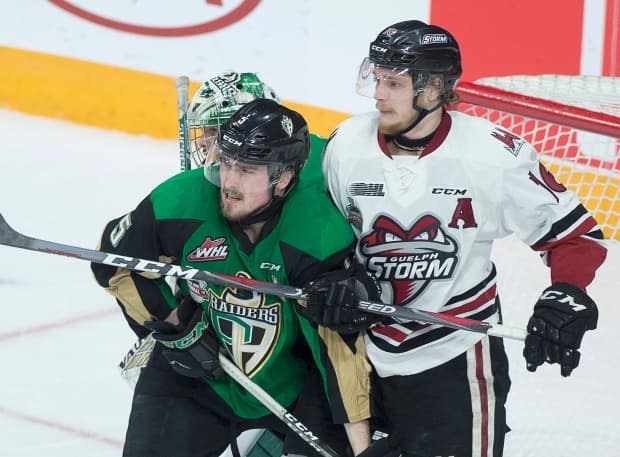 Guelph Storm's Nate Schnarr, right, battles Prince Albert Raiders player Zack Hayes during the 2019 Memorial Cup championship. The 2020 and 2021 tournaments were cancelled because of the pandemic. (Andrew Vaughan/Canadian Press - image credit)