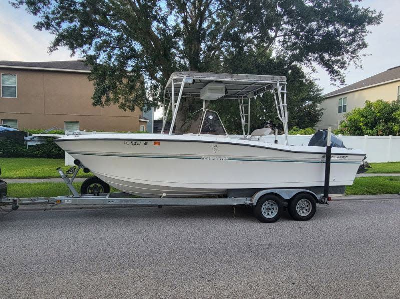 Multiple law enforcement agencies are searching the Gulf of Mexico for four men who did not return from a boating trip Saturday in this 23-foot SportCraft boat.