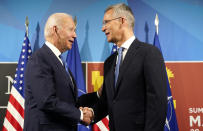 U.S. President Joe Biden, left, is greeted by NATO Secretary General Jens Stoltenberg during arrival for a NATO summit in Madrid, Spain on Wednesday, June 29, 2022. North Atlantic Treaty Organization heads of state and government will meet for a NATO summit in Madrid from Tuesday through Thursday. (AP Photo/Susan Walsh)