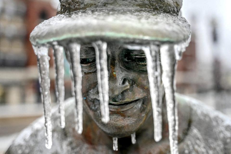 Icicles hang from the hat of a figure that is part of the Hometown Hero baseball sculpture outside Jackson Field in Lansing, Michigan on February 23 ((Nick King/Lansing State Journal/USA TODAY NETWORK via REUTERS))