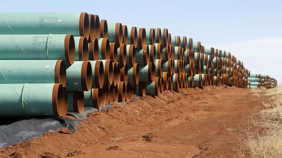 Rows of pipe ready to become part of the Keystone Pipeline are stacked in a field near Cushing, Okla. in Feb. 2012.