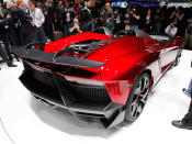 Starting with the everyday 700-hp Aventador, Lamborghini taunted the bull even further by removing the roof, adding several aerodynamic panels and generally shucking weight from a car that only had 3,472 lbs. to begin with. Even the seat fabrics have been swapped for something Lamborghini calls "Carbonskin," a fabric made from carbon fibers that's at least a decade away from being used on a teenager's hat. With no windshield, the interior has to get some form of waterproofing; the rear mirror pops up like Wall-E's head from the center of the dash. It and the roll bars behind the driver are the highest points in the car.