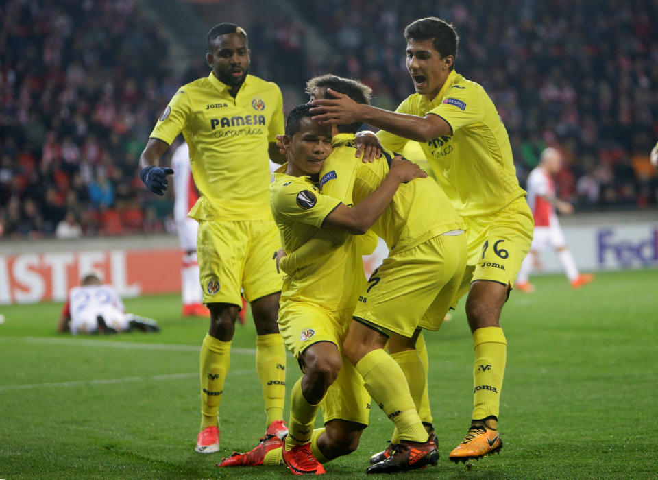 Villarreal’s Carlos Bacca celebrates scoring their first goal with team mates REUTERS/David W Cerny