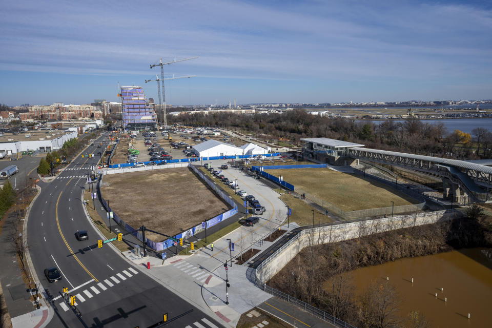 A general view showing the site for a proposed new stadium for the Washington Wizards NBA basketball team and Washington Capitals HNL hockey team, Wednesday, Dec. 13, 2023, in Alexandria, Va. Virginia Gov. Glenn Youngkin has reached a tentative agreement with the parent company of the NBA's Washington Wizards and NHL's Washington Capitals to move those teams from the District of Columbia to what he called a new "visionary sports and entertainment venue" in northern Virginia. (AP Photo/Alex Brandon)