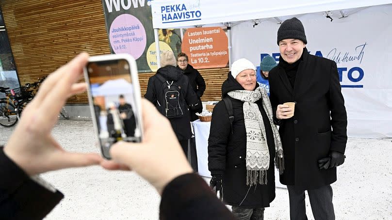 Member of Greens Party, presidential candidate Pekka Haavisto, right, has a photo taken with Minna Joentakanen during campaigning in Helsinki, Finland on December 16, 2023.