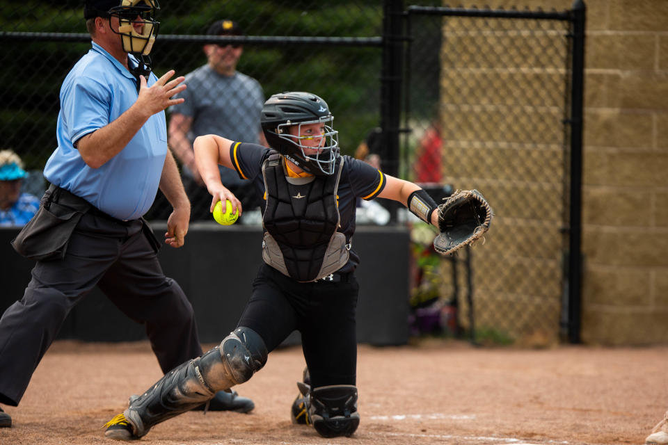 Hamilton's Ella Davison throws the ball back to the pitcher Tuesday, May 16, 2023, at Hamilton High School. 