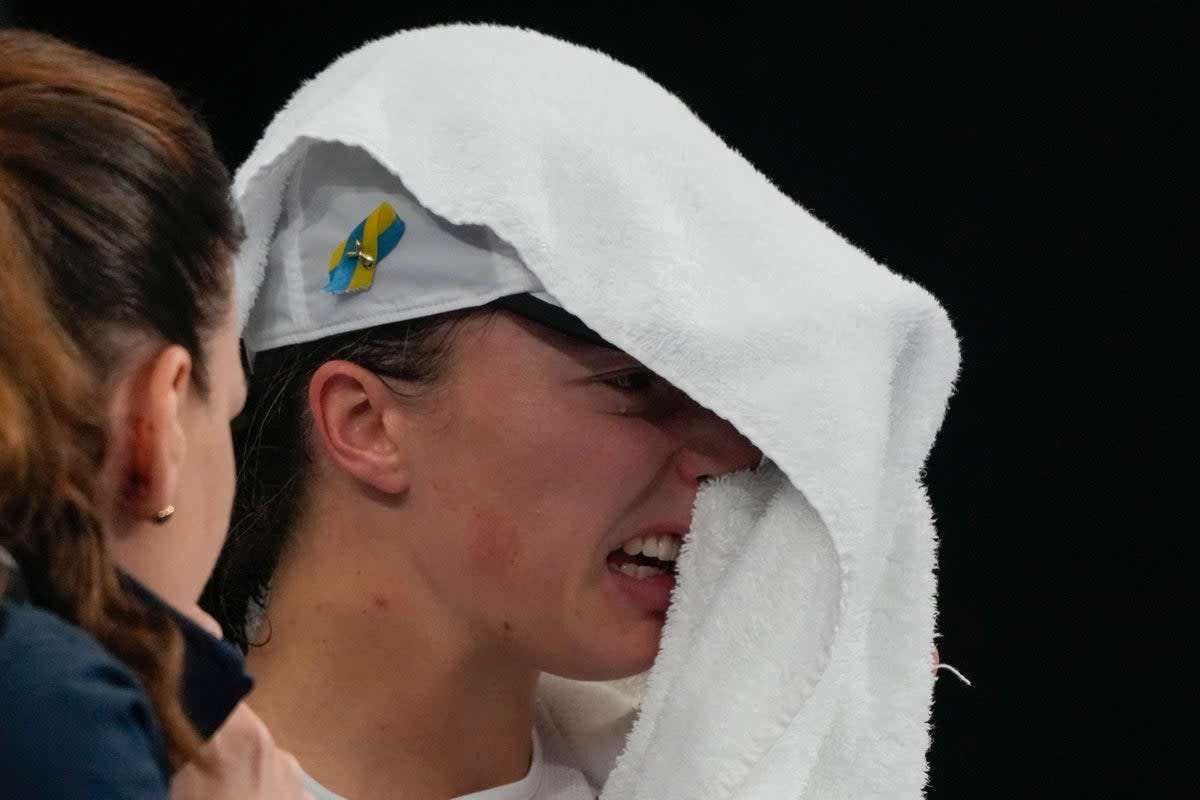 Iga Swiatek shows her emotions after losing to Jessica Pegula (Mark Baker/AP) (AP)