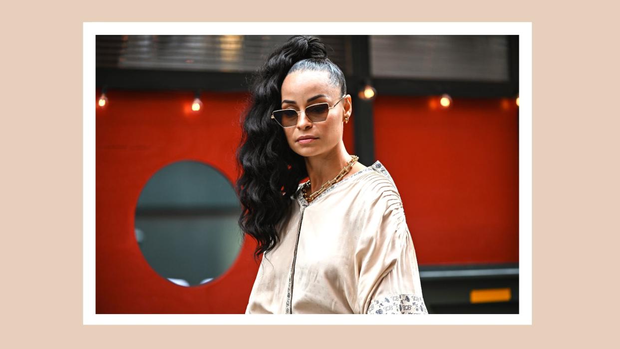   Sai de Silva is seen wearing a cream Tory Burch dress outside the Tory Burch show during New York Fashion Week S/S 22 on September 12, 2021 in New York City 