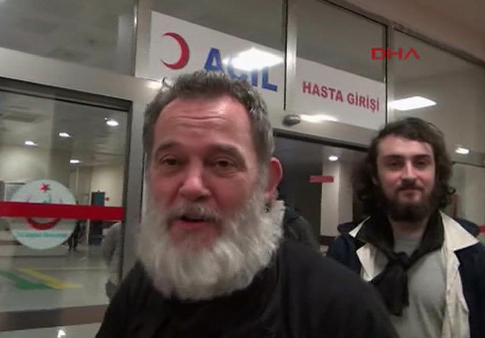 In this photo made from video, two of the four French journalists who went missing in Syria last summer, Didier Francois, foreground, and Edouard Elias, right, leave a local hospital after a medical check, in Akcakale, Turkey, Saturday, April 19, 2014. Four French journalists who went missing in Syria last summer were found blindfolded and cuffed in Turkey's southeast Sanliurfa province late Friday, according to a private Turkish news agency. Dogan News Agency (DHA) said Edouard Elias, Didier Francois, Nicolas Henin and Pierre Torres were found by Turkish soldiers on routine patrol after the journalists were dropped off near the Turkey-Syria border by an unknown group. (AP Photo/DHA) TURKEY OUT TV OUT