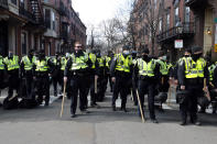 FILE - In this Jan. 17, 2021, file photo, Boston police officers stand in a street in the Beacon Hill neighborhood near the Statehouse in Boston as a precaution against demonstrations following the breach of the U.S. Capitol earlier in the month. Boston's police department remains largely white, despite vows for years by city leaders to work toward making the police force look more like the community it serves. (AP Photo/Michael Dwyer, File)