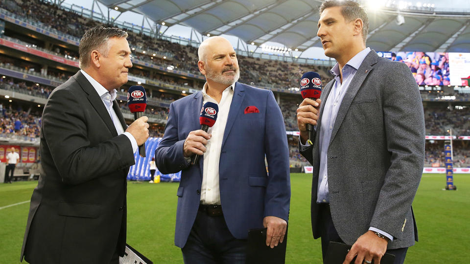 Jason Dunstall, pictured here in commentary before an AFL match.