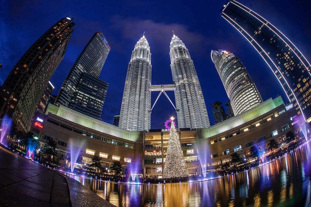 The beautiful Christmas tree lit up at night at Suria KLCC. — Picture by Hari Anggara