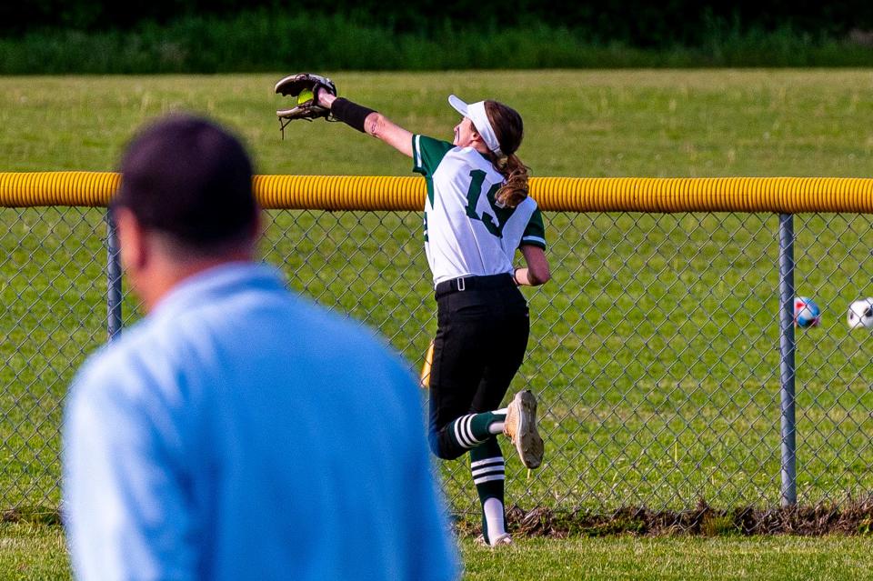 Dartmouth's Kathryn Lancaster pulls in the line drive feet before the fence in center field.