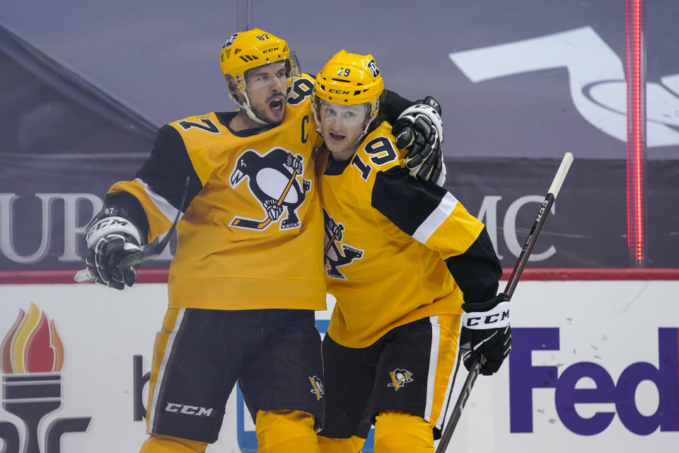 PITTSBURGH, PA - MARCH 27: Pittsburgh Penguins Center Sidney Crosby (87) celebrates his goal with Pittsburgh Penguins Center Jared McCann (19) during the second period in the NHL game between the Pittsburgh Penguins and the New York Islanders on March 27, 2021, at PPG Paints Arena in Pittsburgh, PA. (Photo by Jeanine Leech/Icon Sportswire via Getty Images)