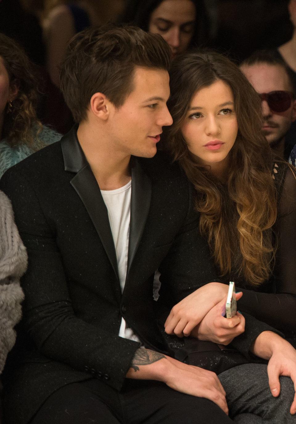 Louis and Eleanor sitting together at a show