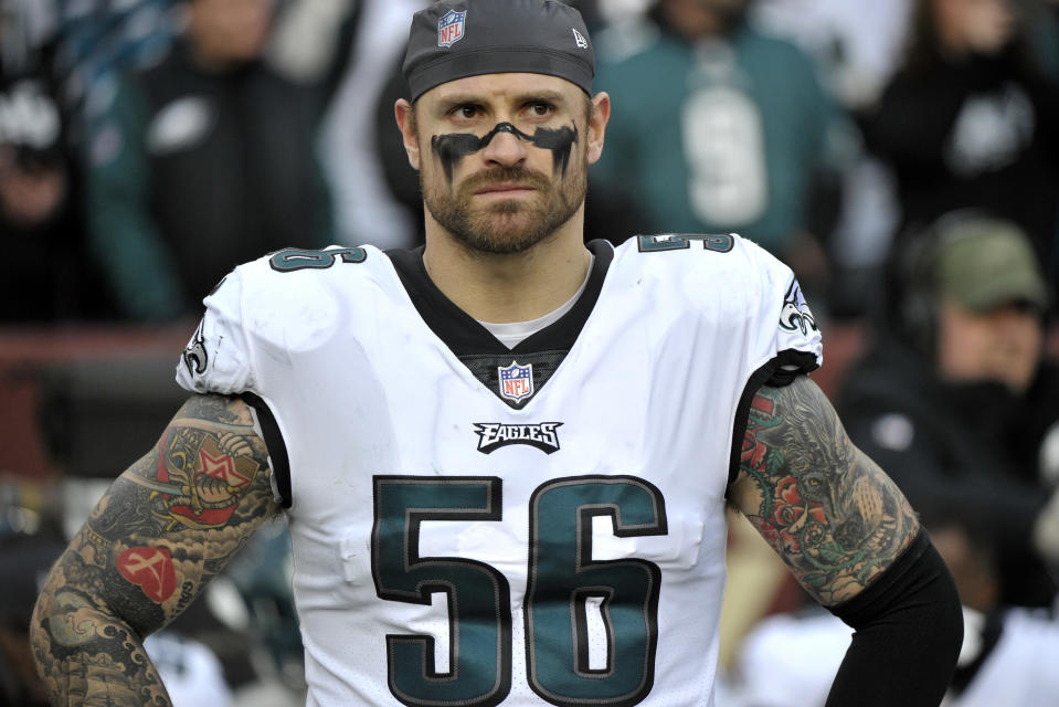 FILE - In this Dec. 30, 2018, file photo, Philadelphia Eagles defensive end Chris Long stands on the sideline prior to the team's NFL football game against the Washington Redskins in Landover, Md. Long has announced his retirement from football, ending an 11-year NFL playing career that included winning two Super Bowl titles and the Walter Payton Man of the Year Award. Long posted his decision Saturday night, May 18, on Twitter, saying it has "been a hell of a journey" and adds that "I can honestly say I put my soul into every minute of it." (AP Photo/Mark Tenally, File)