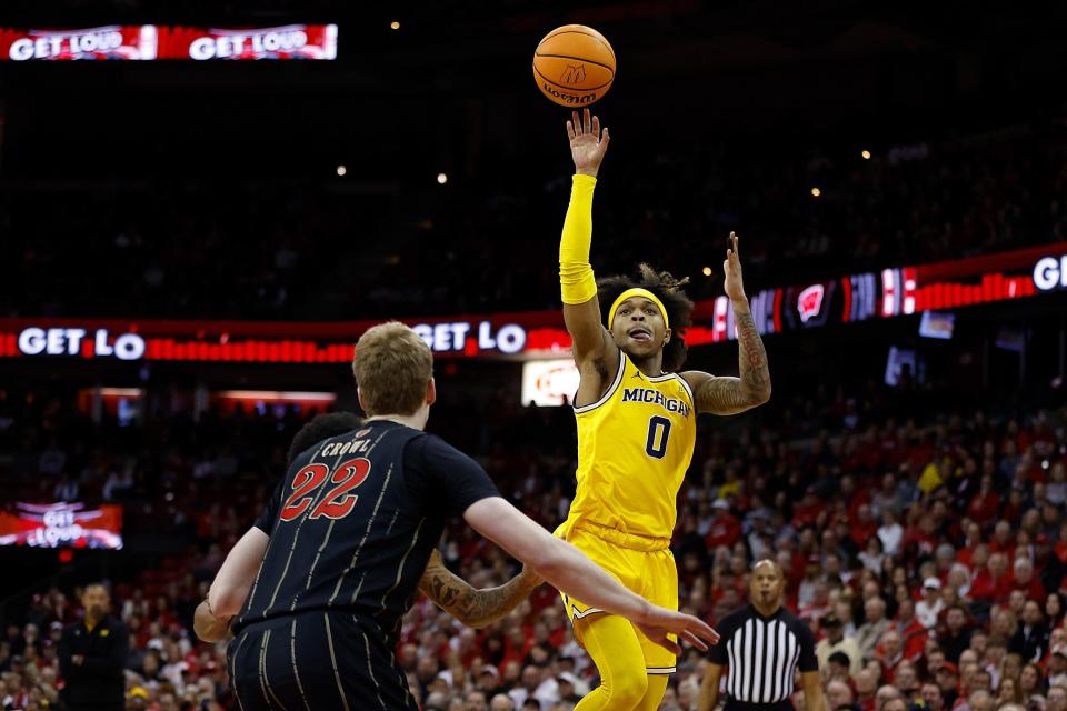 Michigan guard Dug McDaniel shoots a running jump shot during the first half on Tuesday, Feb. 14, 2023, in Madison, Wisconsin.