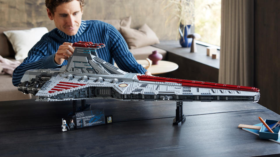  A man looks on at the Lego Venator set 