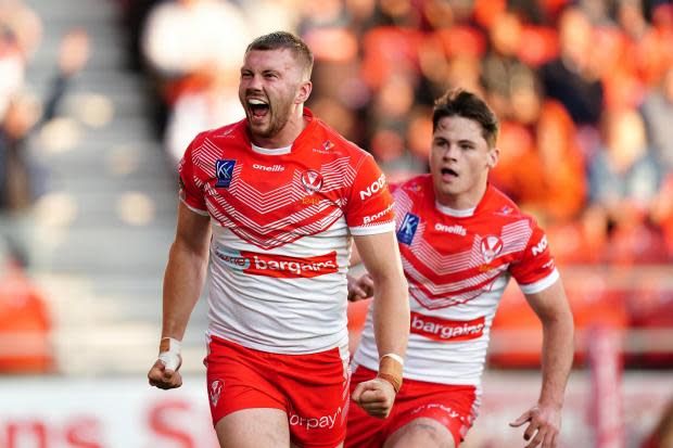 St Helens' Joe Batchelor celebrates his try against Huddersfield Giants at the Totally Wicked Stadium. Picture: Mike Egerton/PA Wire