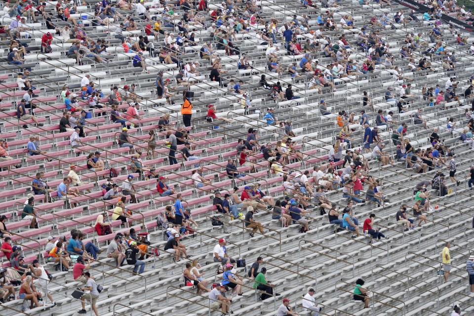 Fans socially distance in the stands due to COVID-19 as they watch the IndyCar auto race at World Wide Technology Raceway on Saturday, Aug. 29, 2020, in Madison, Ill. (AP Photo/Jeff Roberson)