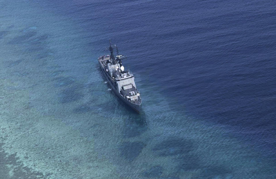 In this photo provided by the Armed Forces of the Philippines, the Philippine Navy ship BRP Gregorio del Pilar is seen after it ran aground during a routine patrol Wednesday, Aug. 29, 2018, in the vicinity of Half Moon Shoal, which is called Hasa Hasa in the Philippines, off the disputed Spratlys Group of islands in the South China Sea, adding that its crew was unhurt, the military said. Two officials say Friday, Aug. 31, 2018, the Philippines has notified China about a Philippine navy frigate that ran aground in the South China Sea to avoid any misunderstanding because the incident happened near a hotly disputed region. The barren shoal is on the eastern edge of the disputed Spratly archipelago. (Armed Forces of the Philippines via AP)