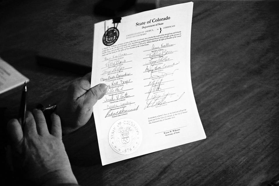 A Colorado elector holds a signed vote certificate during the electoral vote at the Capitol in Denver on Dec. 19, 2016. The state’s nine Democratic electors cast their votes for Hillary Clinton after one elector was removed from the panel for voting for another candidate, which spawned a lawsuit to which the Supreme Court affirmed the constitutionality of removing “faithless electors.”