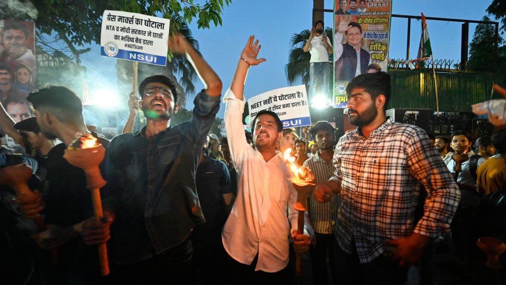 NEW DELHI, INDIA - JUNE 15: Members of NSUI protest Mashal March organized by NSUI to protest against the alleged rigging in the NEET Exams, they demand a fair investigation and re-conduct of the examination (RENEET). at NSUI office , Raisina road, on June 15, 2024 in New Delhi, India. (Photo by Sanchit Khanna/Hindustan Times via Getty Images)