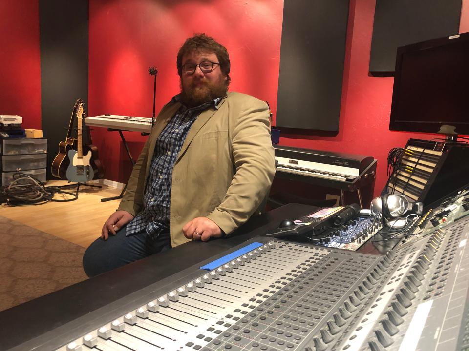 Julian Sundby mans the soundboard at Hero Song's new The Fort Studios in Fort Myers.
