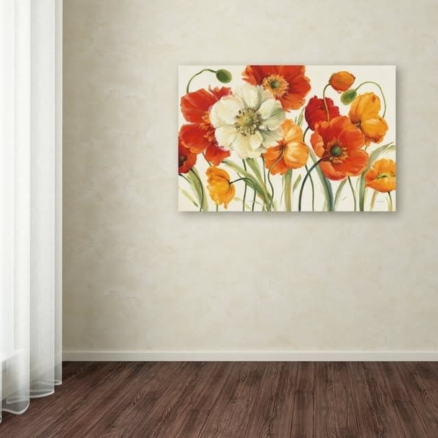 the canvas with several bright red poppies hanging on a wall