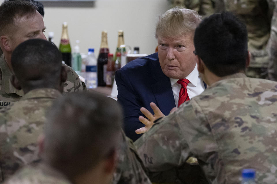President Donald Trump speaking to members of the military in a dining facility during a surprise Thanksgiving Day visit, Thursday, Nov. 28, 2019, at Bagram Air Field, Afghanistan. (AP Photo/Alex Brandon)